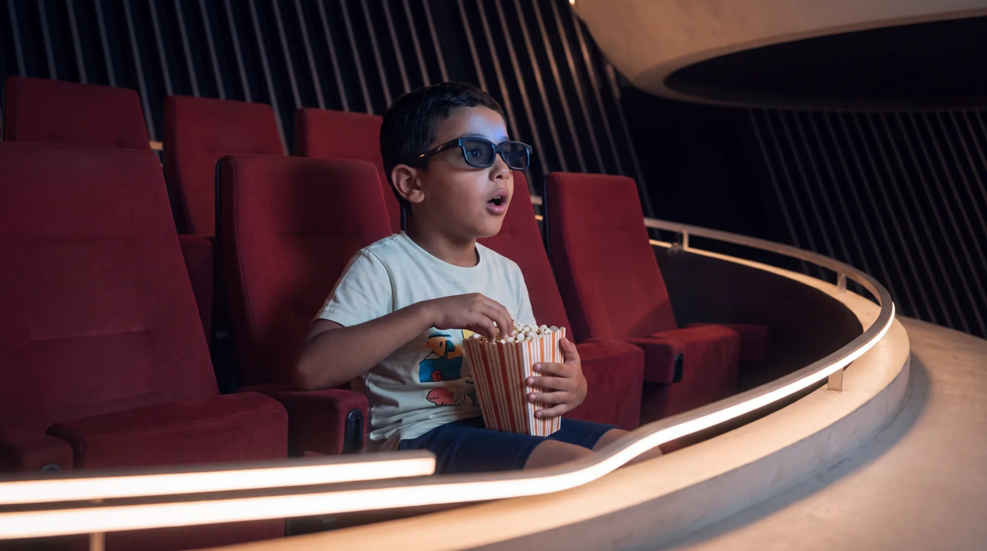 A child watching a film at BEAM Cinemas
